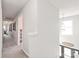 Upstairs hallway featuring carpet flooring and a view of the staircase at 3929 Wexford Ln, Denver, NC 28037