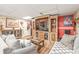 Finished basement with a living room, hardwood floors, and entertainment center at 3929 Wexford Ln, Denver, NC 28037