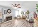 Comfortable living room features a fireplace, ceiling fan, and ample seating at 3929 Wexford Ln, Denver, NC 28037