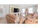 Spacious living room featuring a large TV, comfortable seating, and great natural light at 3929 Wexford Ln, Denver, NC 28037