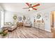 Relaxing living room with stylish decor, ceiling fan, and plenty of natural light at 3929 Wexford Ln, Denver, NC 28037
