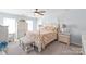 Spacious main bedroom featuring a ceiling fan and traditional decor at 3929 Wexford Ln, Denver, NC 28037