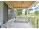 Cozy front porch with a swing and a wooden ceiling, perfect for relaxing and enjoying the outdoors in comfort at 3929 Wexford Ln, Denver, NC 28037