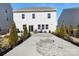 Private backyard with a stone fire pit, seating area, and lush landscaping at 4253 Spadefoot Ct, Lancaster, SC 29720
