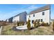 Landscaped backyard with a fire pit area, patio, and well-maintained lawn at 4253 Spadefoot Ct, Lancaster, SC 29720