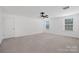 Unfurnished bedroom featuring carpeted floor, a ceiling fan, and plenty of natural light at 4253 Spadefoot Ct, Lancaster, SC 29720