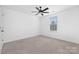 Spacious, unfurnished bedroom with a ceiling fan, carpeted floor, and natural light at 4253 Spadefoot Ct, Lancaster, SC 29720