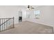 Bonus room features a washer and dryer, ceiling fan, and natural lighting from a window at 4253 Spadefoot Ct, Lancaster, SC 29720