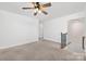 Spacious bonus room with ceiling fan, neutral walls, and natural lighting from a window at 4253 Spadefoot Ct, Lancaster, SC 29720