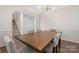 Elegant dining room with wainscoting detail, and an open view to the staircase at 4253 Spadefoot Ct, Lancaster, SC 29720
