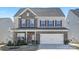 Charming two-story home with brick accents, a two-car garage, and a well-manicured front yard at 4253 Spadefoot Ct, Lancaster, SC 29720