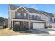 Inviting two-story home with brick accents, a two-car garage, and well-maintained landscaping at 4253 Spadefoot Ct, Lancaster, SC 29720