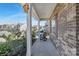 Cozy front porch with rocking chair, brick facade, and a view of the neighborhood at 4253 Spadefoot Ct, Lancaster, SC 29720