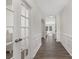 Bright hallway featuring hardwood floors, wainscoting, and french doors at 4253 Spadefoot Ct, Lancaster, SC 29720