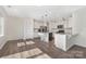 Bright, open kitchen with stainless steel appliances, granite countertops, and a center island with seating at 4253 Spadefoot Ct, Lancaster, SC 29720