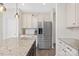 Bright kitchen featuring granite countertops, stainless steel appliances, and cream-colored cabinets at 4253 Spadefoot Ct, Lancaster, SC 29720