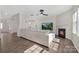 Open concept living room featuring hardwood floors, a fireplace, and a large sofa at 4253 Spadefoot Ct, Lancaster, SC 29720