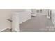 Upstairs living room features neutral walls, plush carpet, and stairway at 4253 Spadefoot Ct, Lancaster, SC 29720