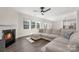 Bright living room with a fireplace, large sectional sofa, and plenty of natural light at 4253 Spadefoot Ct, Lancaster, SC 29720