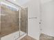 Modern tiled shower with glass door and brushed nickel fixtures at 4253 Spadefoot Ct, Lancaster, SC 29720