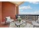 Relaxing outdoor living on the balcony with comfortable seating, a coffee table, and serene views at 572 N Church St, Charlotte, NC 28202