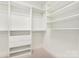 Organized walk-in closet with custom shelving and drawers, providing ample storage space for clothing and accessories at 572 N Church St, Charlotte, NC 28202