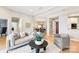 Open-concept living space with hardwood floors and a view into the dining area at 572 N Church St, Charlotte, NC 28202