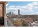 Enjoy stunning city views from this balcony, complete with a grill for outdoor cooking and a cityscape backdrop at 572 N Church St, Charlotte, NC 28202