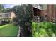Backyard view of home, showcasing a small patio area and surrounding greenery at 591 Bent Oak Trl, Concord, NC 28027
