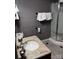 This bathroom features a granite countertop and a glass door shower at 591 Bent Oak Trl, Concord, NC 28027