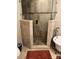 Shower design with decorative tile, glass doors, pebble base, and adjacent soaking tub at 591 Bent Oak Trl, Concord, NC 28027