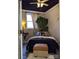 Cozy bedroom featuring a plush bed with neutral tones, natural light, and a decorative plant for a relaxing atmosphere at 591 Bent Oak Trl, Concord, NC 28027