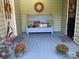 Cozy front porch featuring a decorative bench and seasonal decor for a welcoming entrance at 591 Bent Oak Trl, Concord, NC 28027