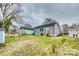 Spacious backyard featuring a well-maintained lawn, a wooden deck, and mature trees at 611 N York St, Gastonia, NC 28052