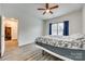 Spacious bedroom features a ceiling fan and a window that allows natural light to illuminate the room at 611 N York St, Gastonia, NC 28052