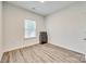 Bedroom with laminate flooring and a single window at 611 N York St, Gastonia, NC 28052