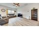 Inviting living room with hardwood floors, neutral colors, and a large TV at 611 N York St, Gastonia, NC 28052