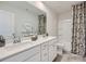Bright bathroom features a double sink vanity with ample counter space, a mirror, and a shower-tub combination at 6271 Fairfax Ct, Maiden, NC 28650