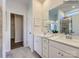Bright bathroom with double vanity, sleek fixtures, and neutral color scheme at 6271 Fairfax Ct, Maiden, NC 28650