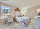 This cozy bedroom features a comfortable bed, stylish decor, a study area, and a beautiful view at 6271 Fairfax Ct, Maiden, NC 28650