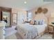 This spacious bedroom features a comfortable bed, stylish decor, and a large dresser at 6271 Fairfax Ct, Maiden, NC 28650