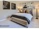 This modern bedroom features neutral walls, carpet, and matching posters and decor at 6271 Fairfax Ct, Maiden, NC 28650