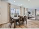 Open concept dining area with wood floors, large windows, and neutral decor for easy personalization at 6271 Fairfax Ct, Maiden, NC 28650