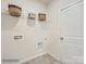 The laundry room features ample shelving for storage and connections for a washer and dryer at 6271 Fairfax Ct, Maiden, NC 28650