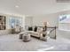 Cozy living room area with a desk, sofa, and plush ottomans at 6271 Fairfax Ct, Maiden, NC 28650