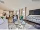 Open-concept living room with hardwood floors, comfortable seating, a modern console, and natural light at 6271 Fairfax Ct, Maiden, NC 28650