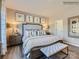 Comfortable main bedroom with natural light, decorative pillows, and hardwood floors at 6271 Fairfax Ct, Maiden, NC 28650