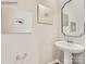 Stylish powder room featuring modern fixtures, elegant mirror, and decorative wall art at 6271 Fairfax Ct, Maiden, NC 28650