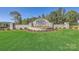 Stone entrance to Shannon Woods featuring lush lawn and landscaping against a backdrop of mature trees, creating a welcoming ambiance at 6283 Fairfax Ct, Maiden, NC 28650