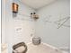 Well-equipped laundry room with decorative elements, great for everyday tasks at 6289 Fairfax Ct, Maiden, NC 28650